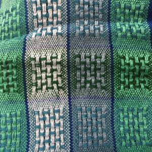 TW Weaving Blue and green huck lace scarf. 100% rayon. 66" x 6.25" excluding fringe.